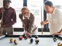 old people playing pool